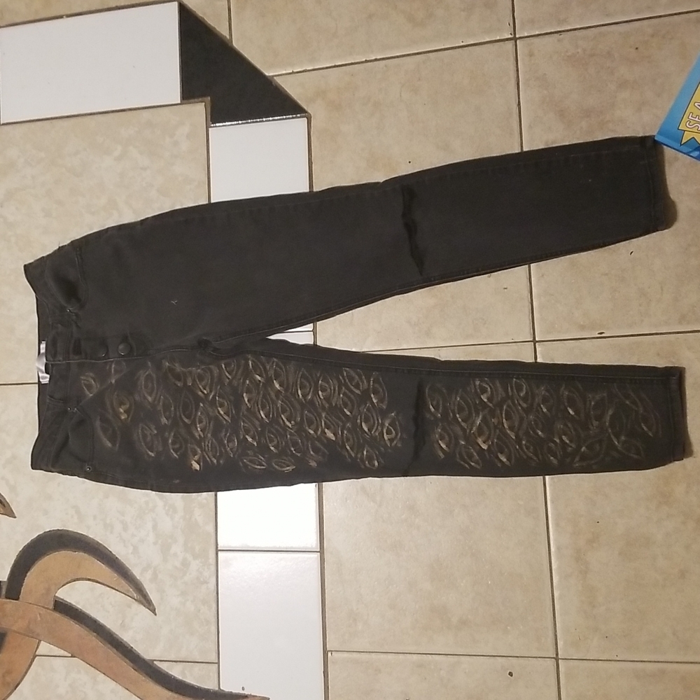 High waisted black jeans with bleached eyes